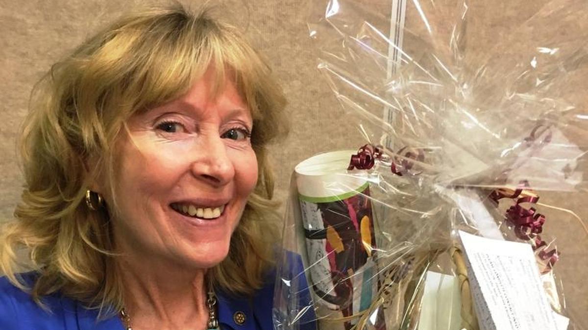 Mary Ann Carson of the Cambria Rotary Club holds up one of the baskets to be included in the silent auction as part of the “Happy Days” fundraising event Oct. 21.