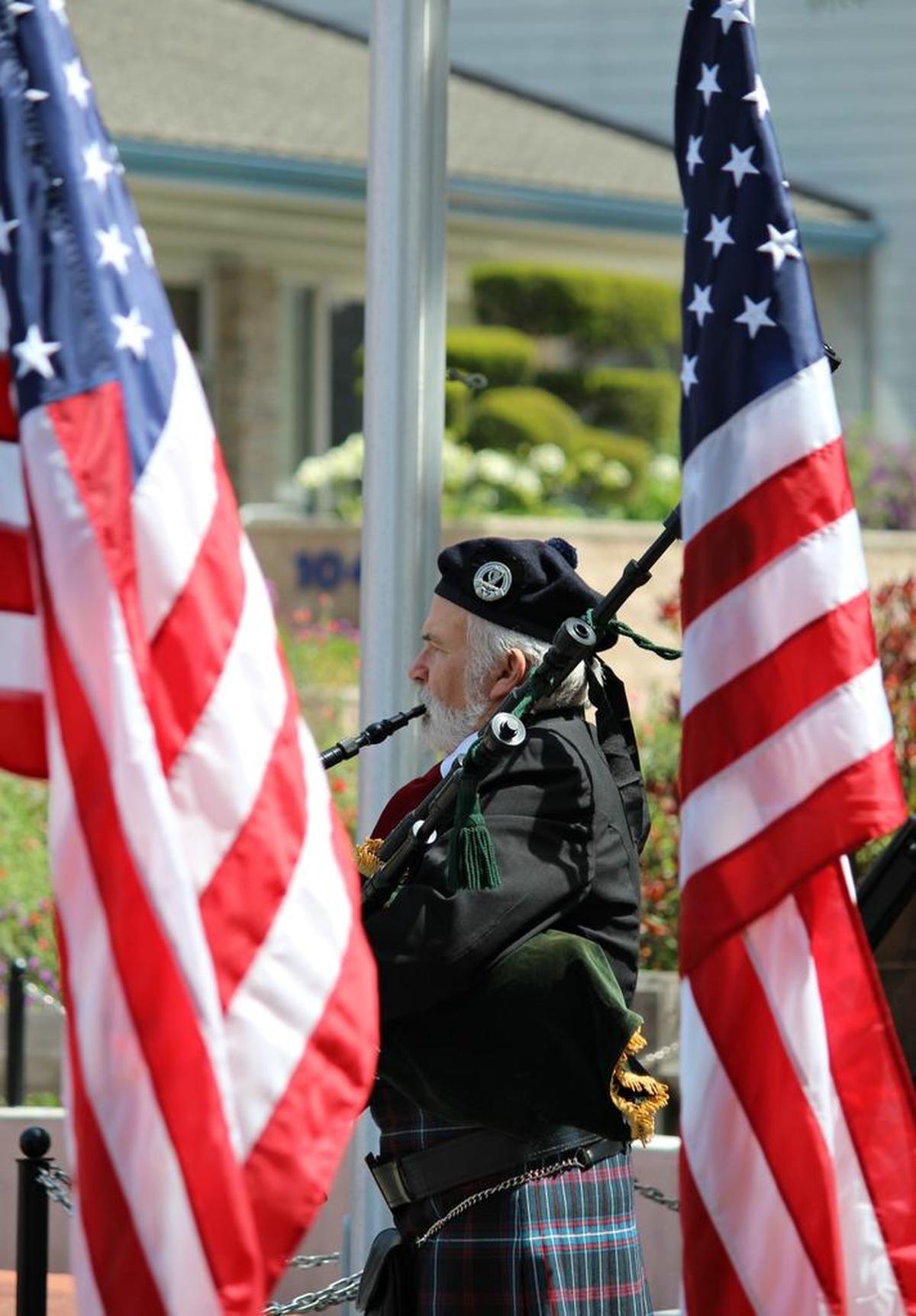 Bagpiper Ed Gallagher plays at the opening of Monday’s Memorial Day ceremony in Cambria.