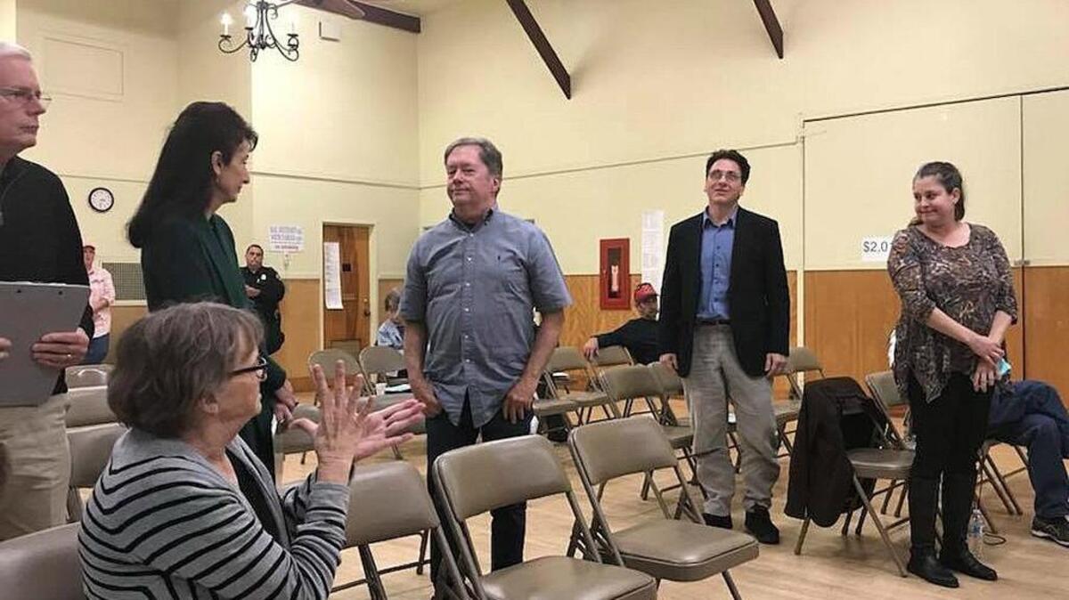 Members of the Buildout Reduction Program Citizens’ Committee stand to be recognized at the Cambria Community Services District board meeting Thursday, Dec. 14.