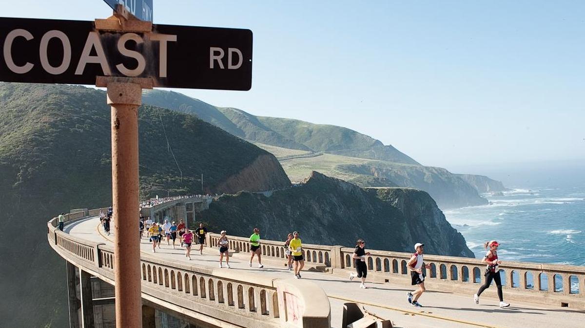 Runners cross Bixby Bridge at the halfway point of Big Sur International Marathon.