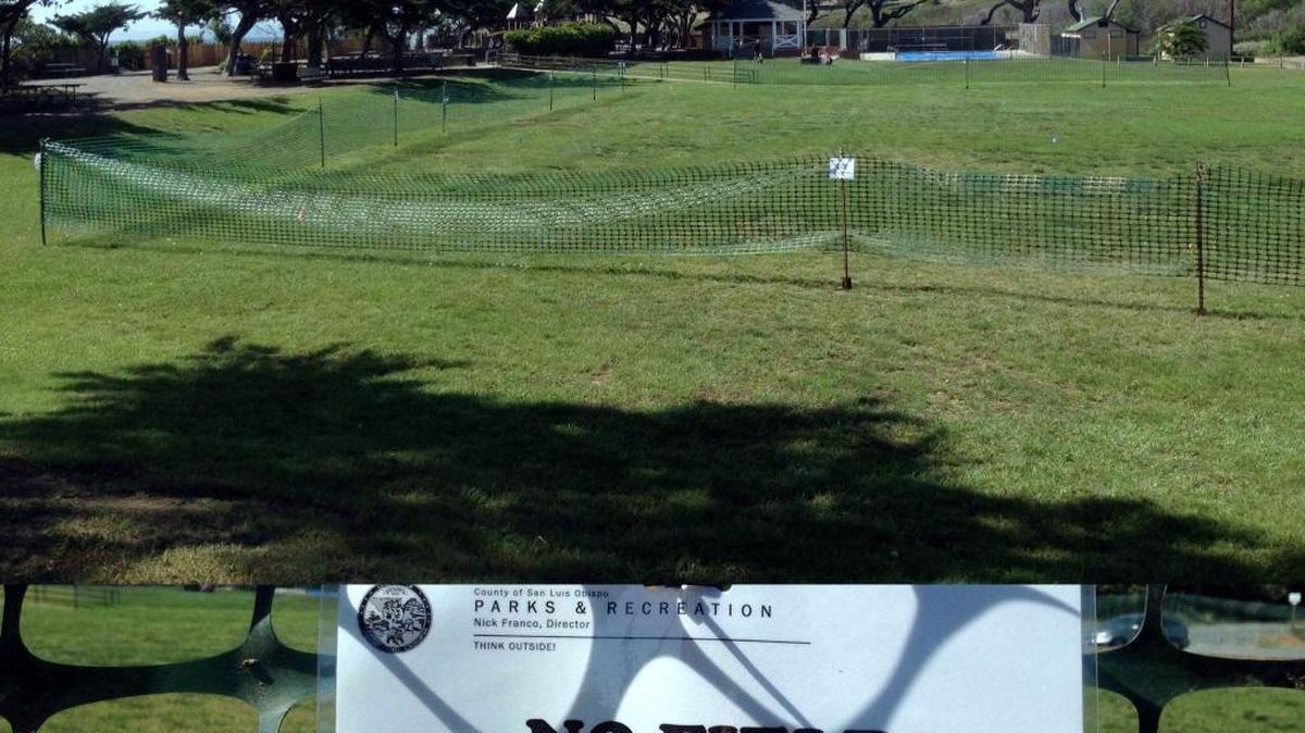 A sign tells visitors to Shamel Park that the sports fields are off limits.