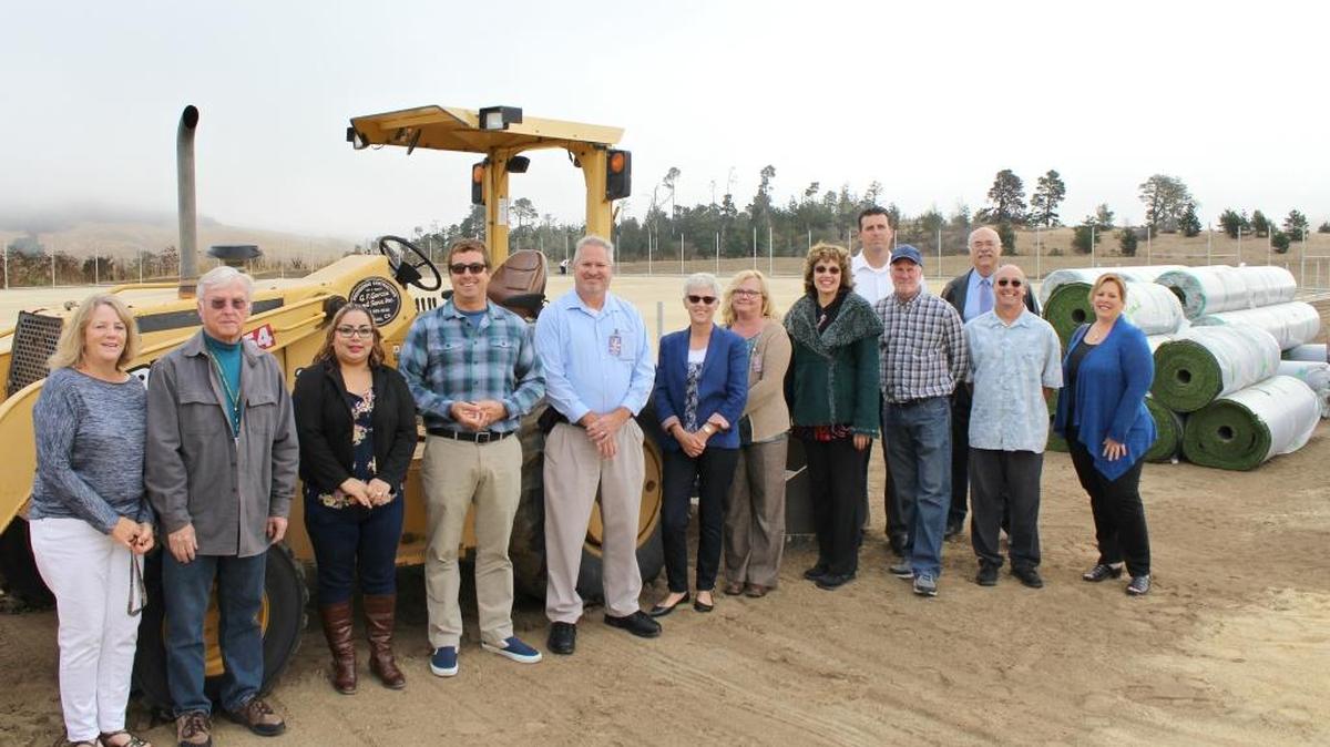 Coast Unified School District officials celebrate the dedication of the new athletic field at Santa Lucia Middle School. From left, librarian Suzanne Kennedy, trustee Lee McFarland, school clerk Lupe Aguilar, SLMS Principal Kyle Martin, Maintenance and Operations Director Lee Wight, trustee Cindy Fratto, trustee Tiffany Silva, Superintendent Vicki Schumacher, high school Principal Scott Ferguson, Grammar School Principal Bob Watt, board President Del Clegg, IT Director Henry Danielson and Business Manager Annie Lachance.