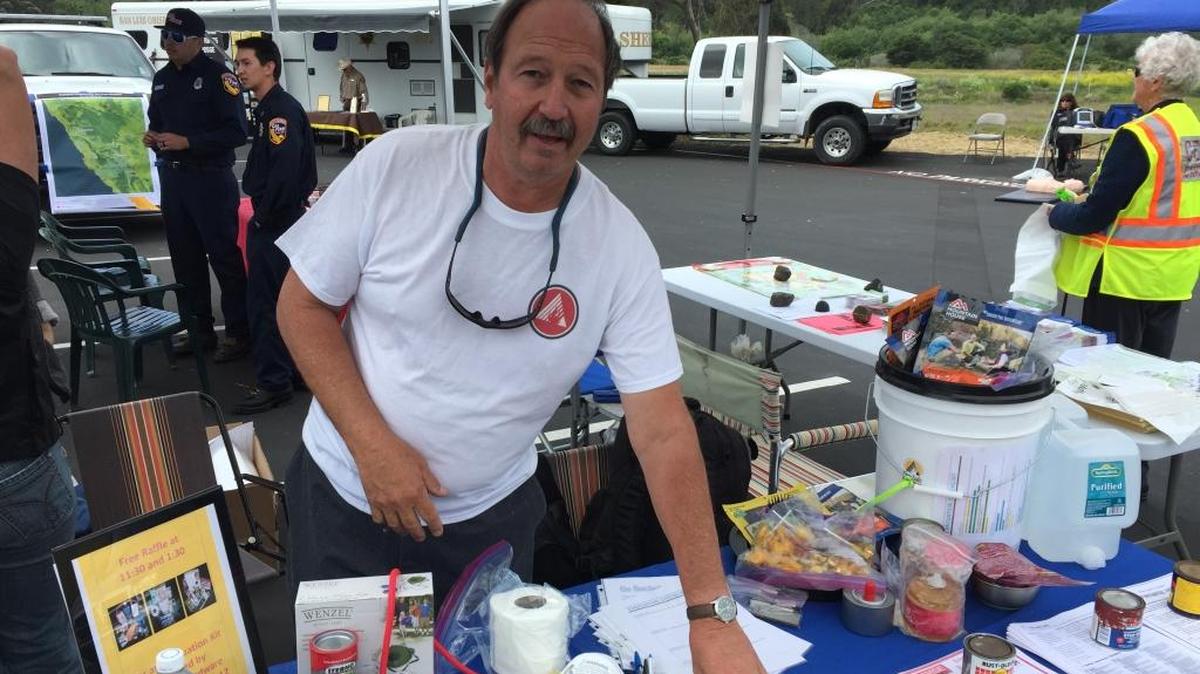 Bruce Fosdike hands out preparedness information at a fire safety fair in May at Santa Rosa Catholic Church in Cambria.