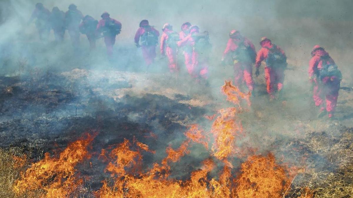 A fire crew walks up a hill during a prescribed burn by Cal Fire at the eastern end of Santa Clara Road in southeast Atascadero in 2011. A burn is planned Friday, Jan. 8, 2020, at Estero Bluffs State Park north of Cayucos.