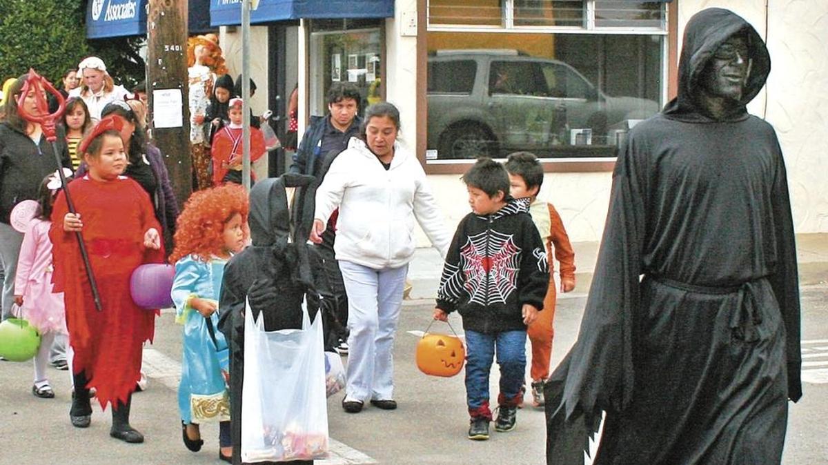 Spectres wander along Main Street in West Village of Cambria in 2012, in search of sugary sustenance.