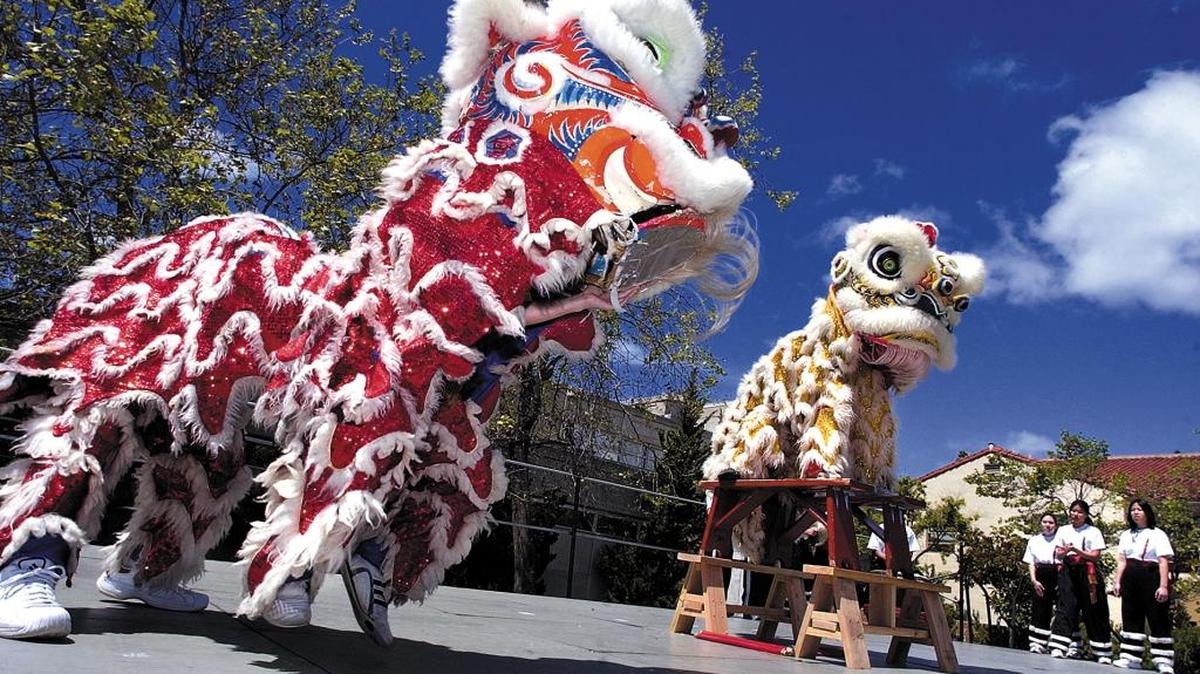 The Cal Poly Lion Dance Team performs on Dexter Lawn during an open house in 2004.