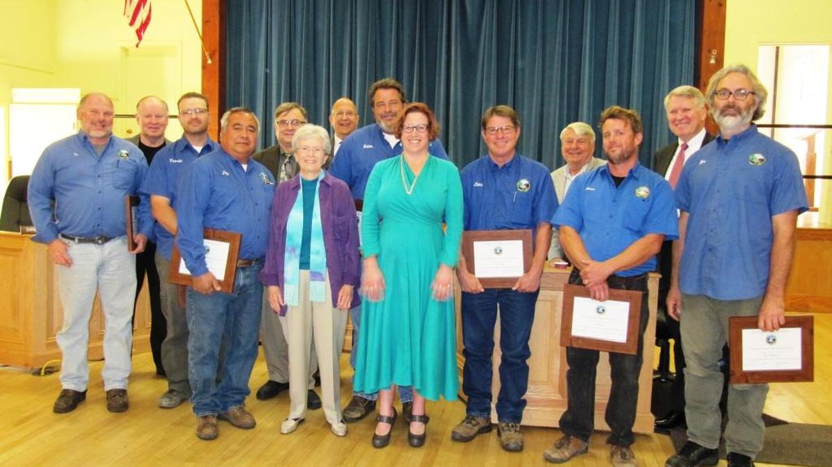 From left, Tim Omarr, Director Mike Thompson, Travis Holt, Jay Block, engineer Bob Gresens, Board President Gail Robinette, General Manager Jerry Gruber, Delonne Blackburn, Director Amanda Rice, John Allchin, Director Jim Bahringer, Jason Buhl, Director Greg Sanders and Ben Grosskruetz were on hand for a ceremony honoring Cambria Community Services District water and wastewater staffers. Larry Moore, also honored, wasn’t at the ceremony, Gruber said, because Moore was working at the Sustainable Water Facility that day. To watch the ceremony, go to http://bit.ly/2heC64N. (It was soon after the start of the meeting.)