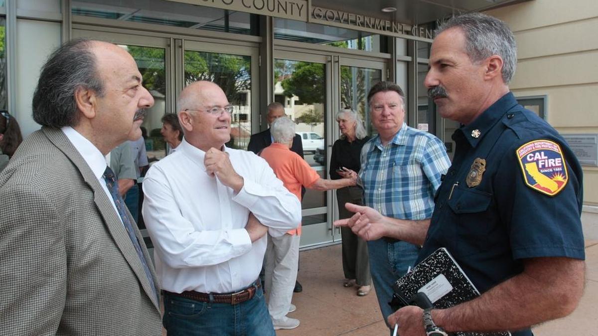 From left: Assemblyman Katcho Achadjian; Frank Mecham, president of the San Luis Obispo County Fire Safe Council; fire council Business Manager Dan Turner and Cal Fire Chief Rob Lewin chat in front of the County Government Center.