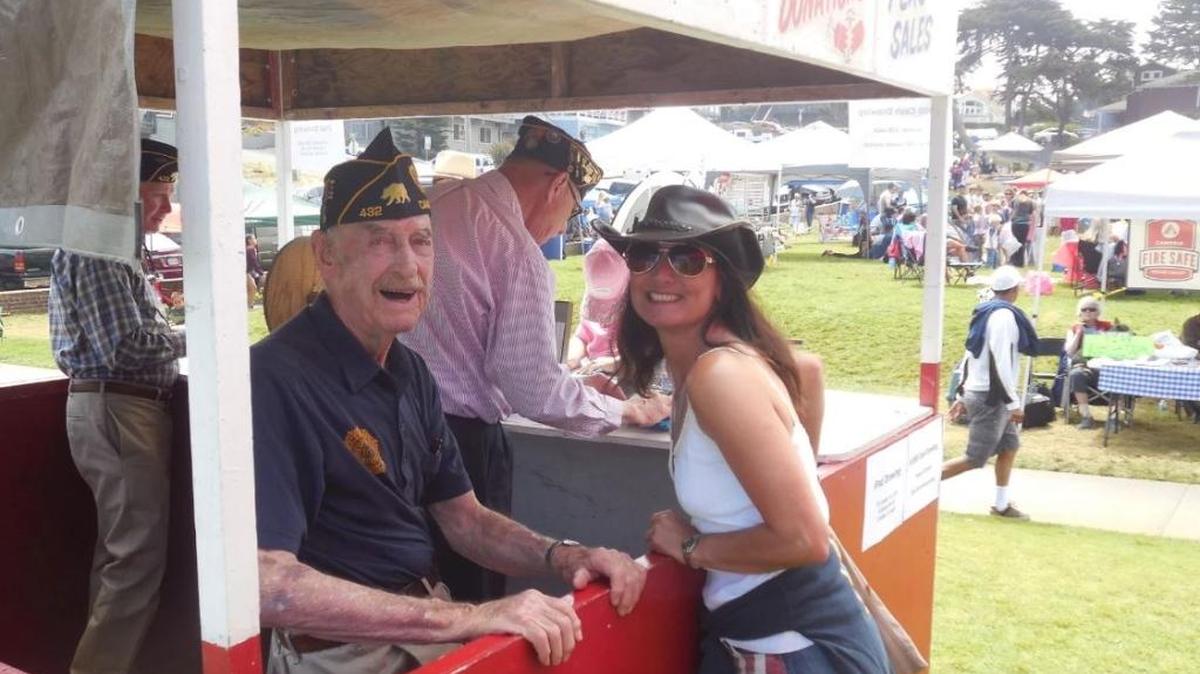 John Angel greets Karina Tiwana at the Legion booth during the 2016 Fourth of July festivities at Shamel Park.