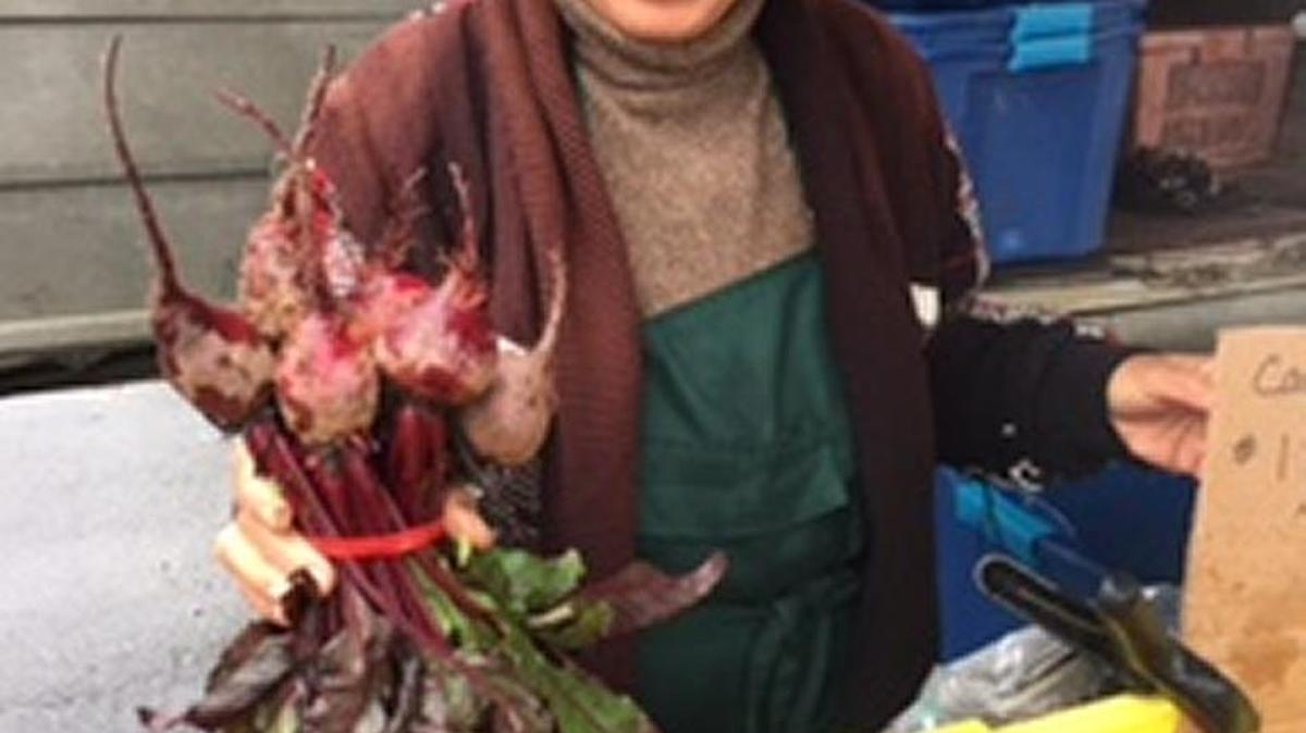 A vendor at the Cambria Farmers Market.