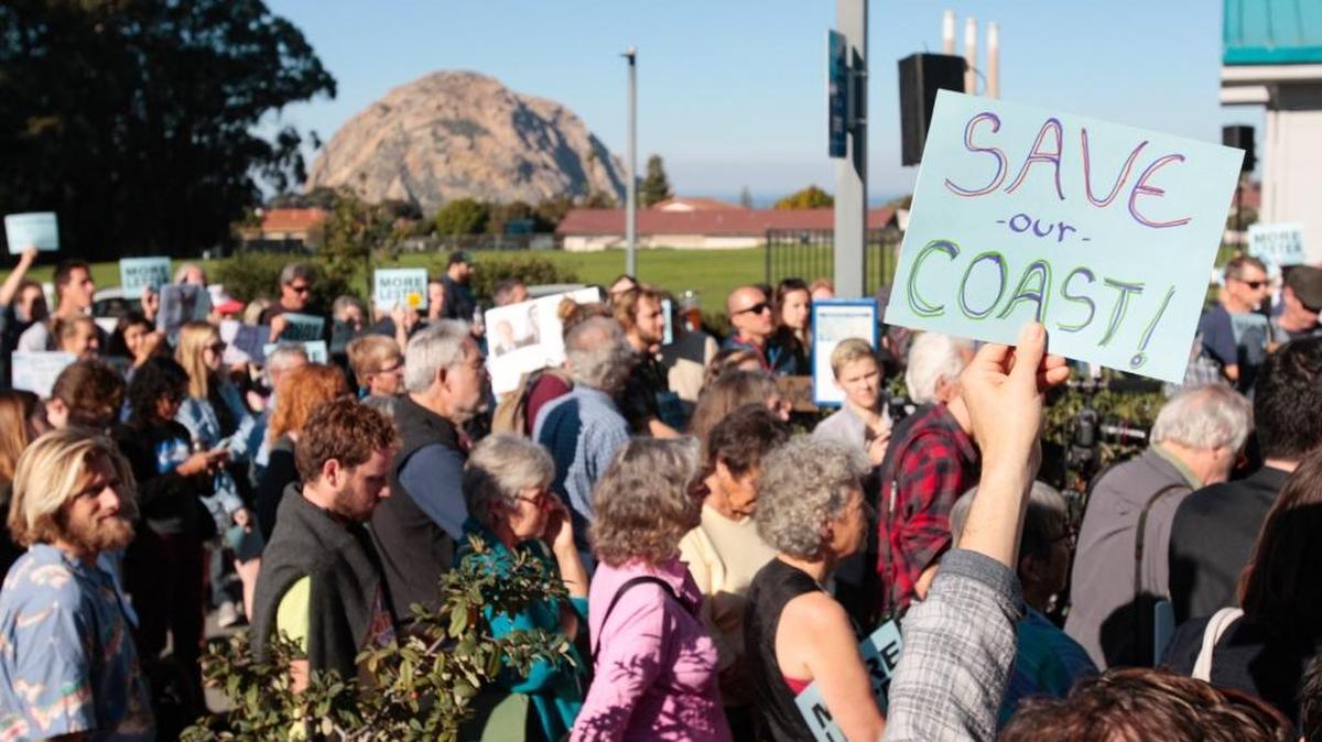 A vote on the dismissal of California Coastal Commission Executive Director Charles Lester is on the agenda at a meeting in Morro Bay. Supporters gather outside the Morro Bay Community Center before hearing.