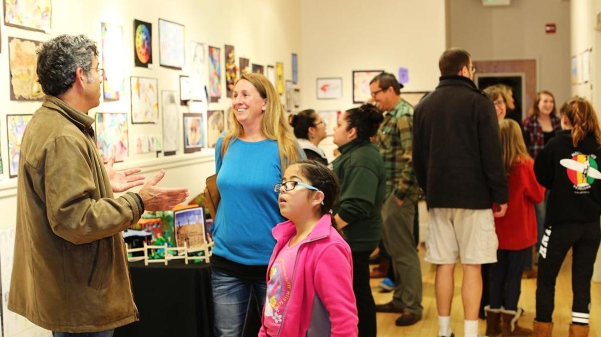 Parents and children take in the exhibits at the Youth Art Show at the Old Cambria Grammar School/Cambria Center for the Arts Gallery.