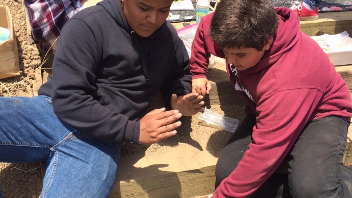 Bibiano Mercado and Jose Aguilar work on their Fairy Garden project.