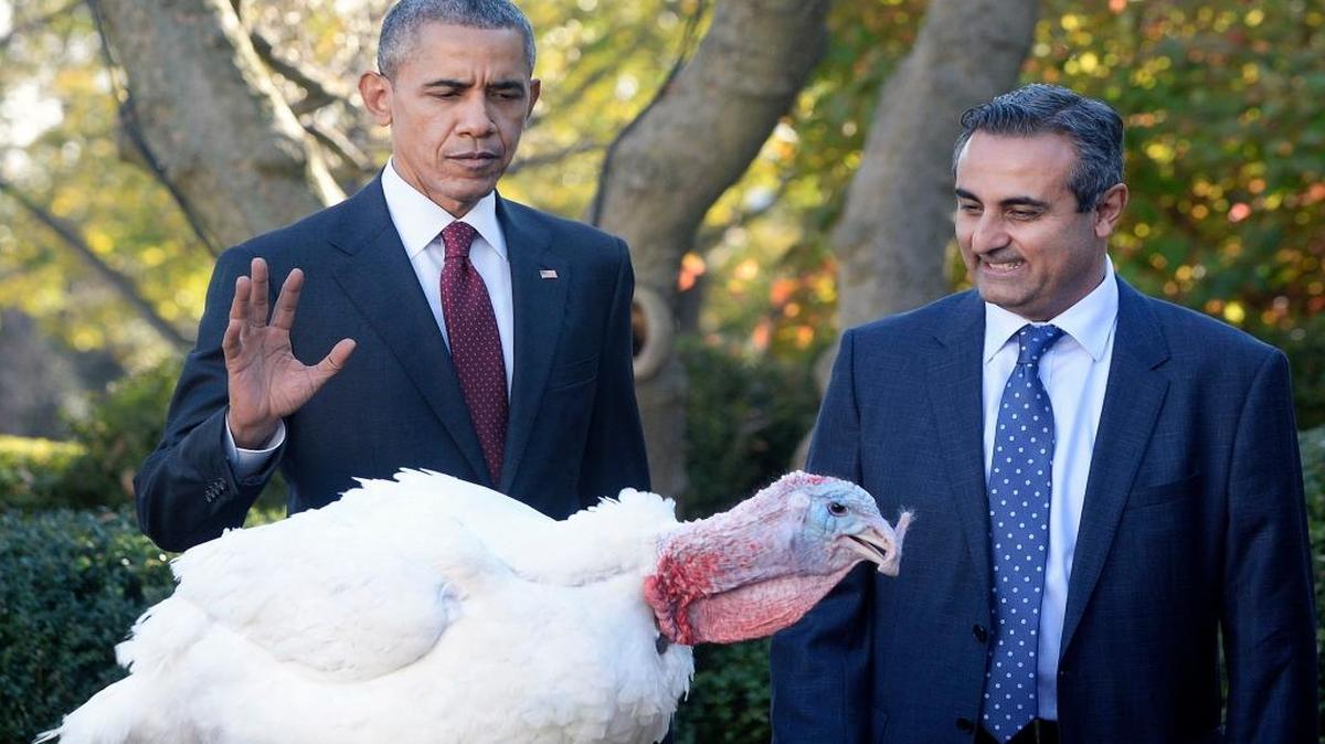 President Barack Obama pardons Abe and its alternate, Honest, not shown, both 18-week-old, 40-pound turkeys, as National Turkey Federation Chairman Dr. Jihad Douglas looks on during a ceremony at the White House on Nov. 25 in Washington, D.C.