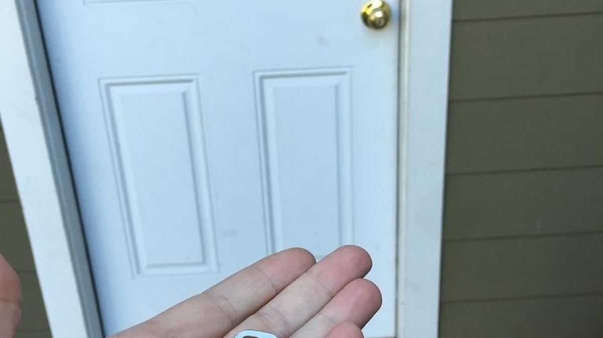 The columnist’s son, Miles Woodsmall, with the key to the front door of his new home. He just closed escrow.