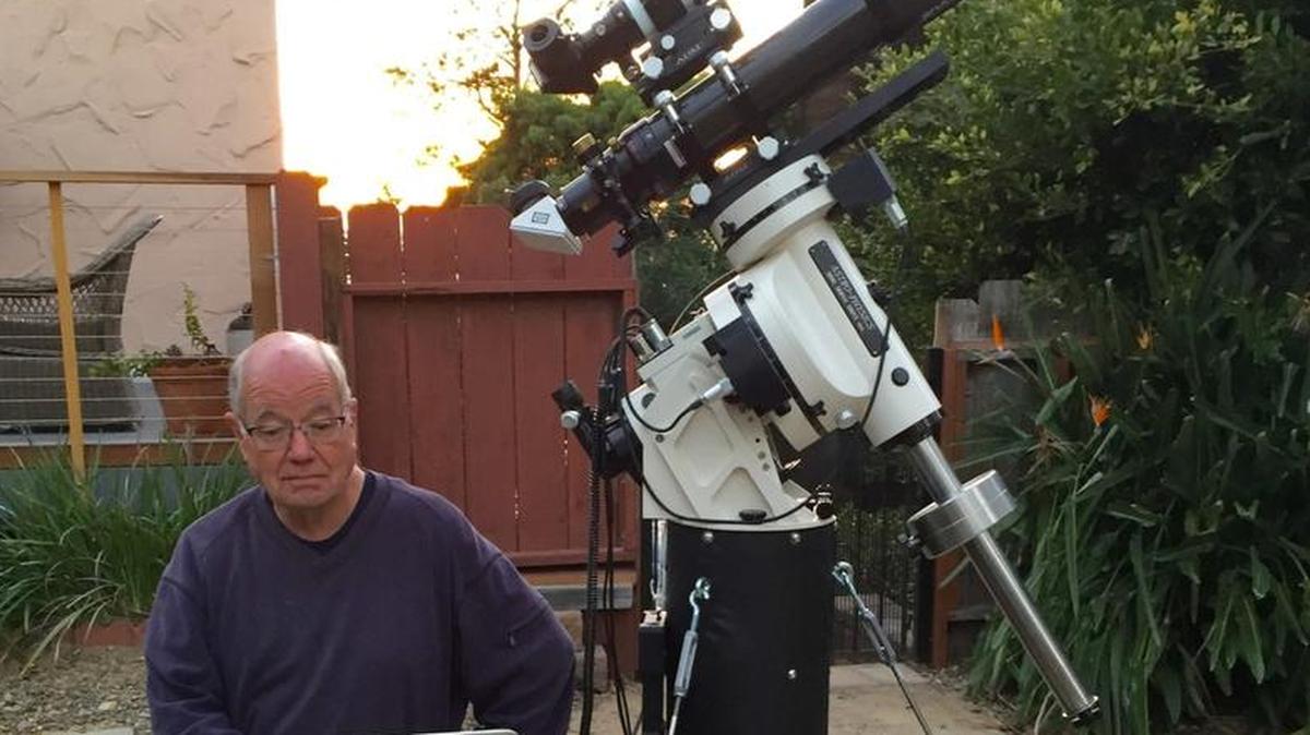 Astronomer Frank Widmann fixes a telescope on the skies.