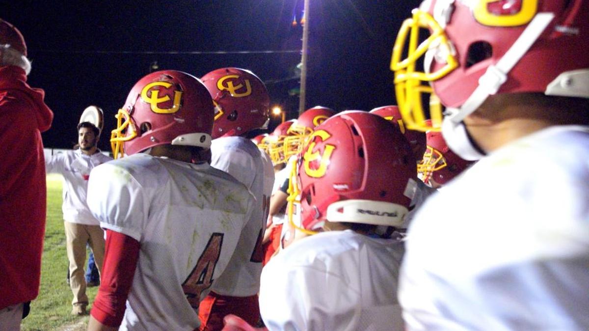 Members of the Coast Union football team watch from the sidelines during their Sept. 30 game at Cuyama Valley.