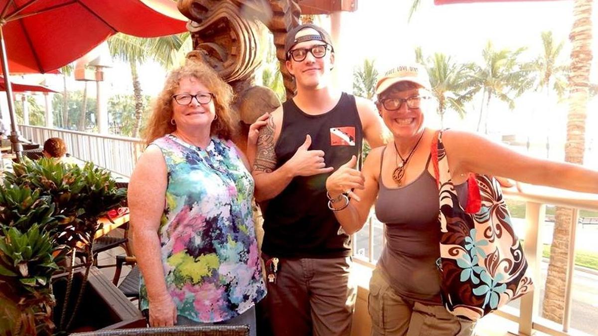 Bambi Fields, Zachary Brooke the columnist and some “local dude” on the strip at Waikiki.