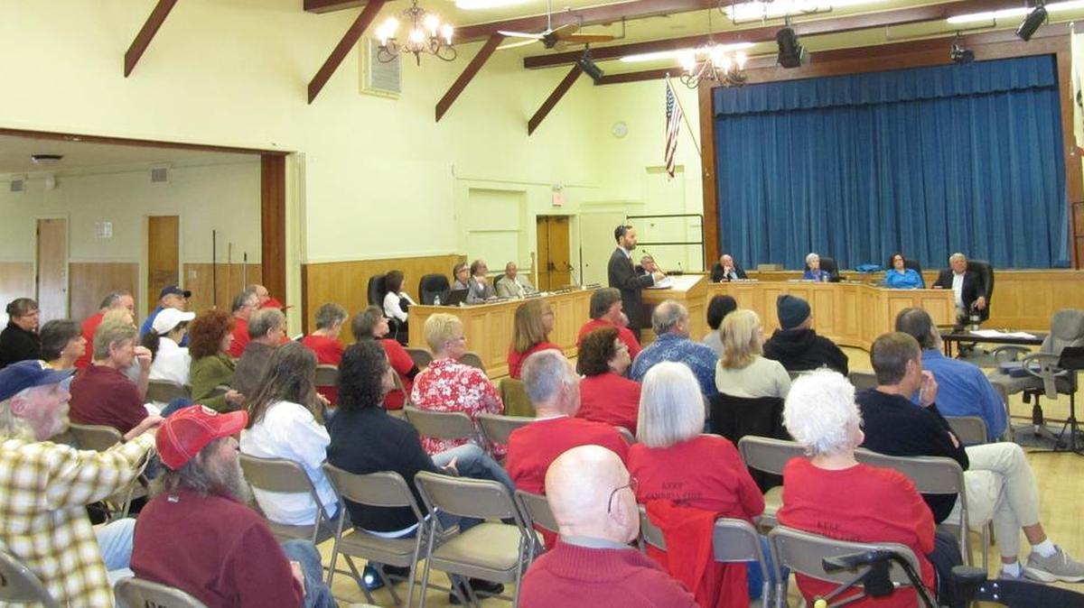 Financial consultant Alex Handlers of Bartle Wells presenting rate-increase information to the CCSD board and more than 50 attendees.