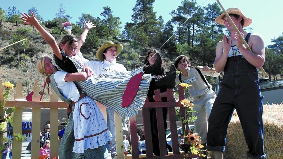 The Linn’s float carries, from left Reese Tartalia, 11, Faith De La Cruz, 11, and Logan Hodges, 19, dressed as different characters from books in a recent Pinedorado Parade. The 68th annual event is coming up in September.