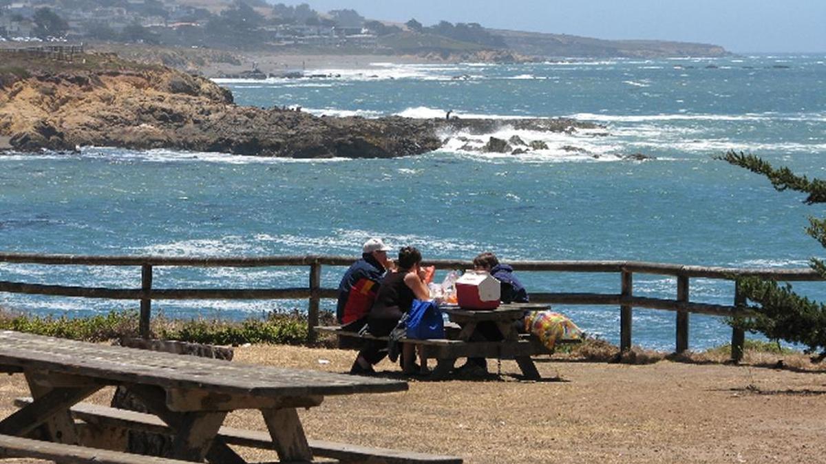 A family enjoys a picnic outing at Leffingwell Landing.