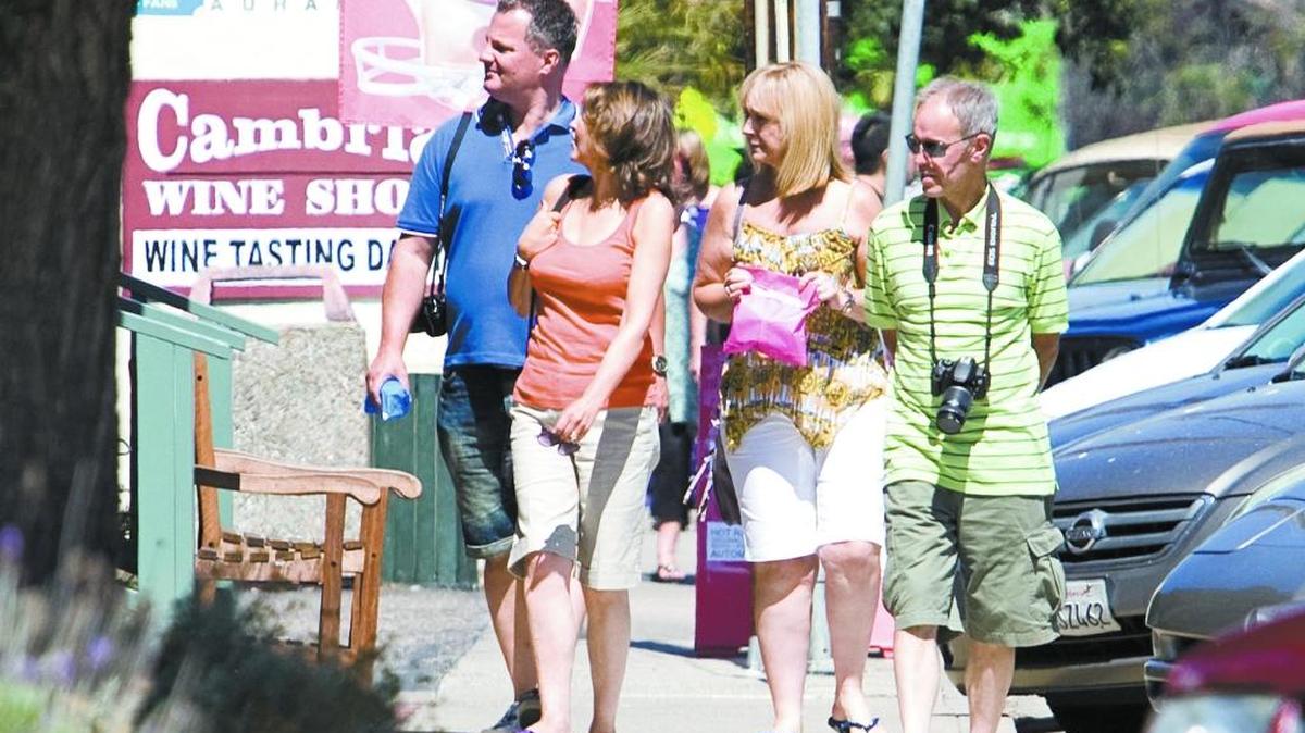 Tourists take in the sights of Cambria’s West Village in this photo from August 2014.