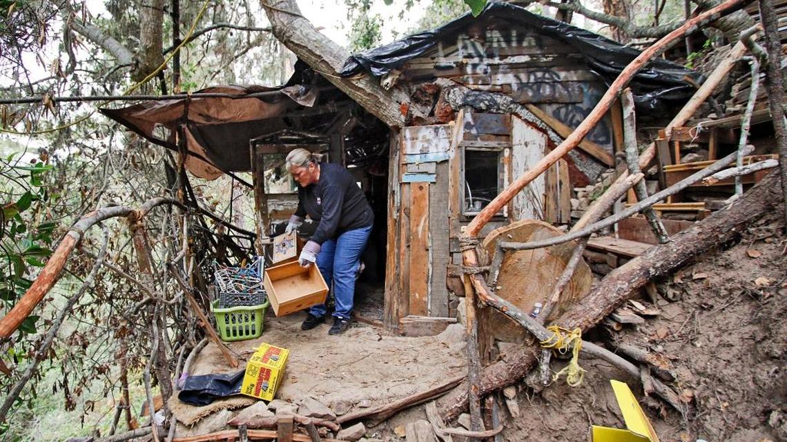 Cambria resident Juanita Poff helps clean out an illegal encampment at the north end of Trenton Avenue in this photo from July 2015.