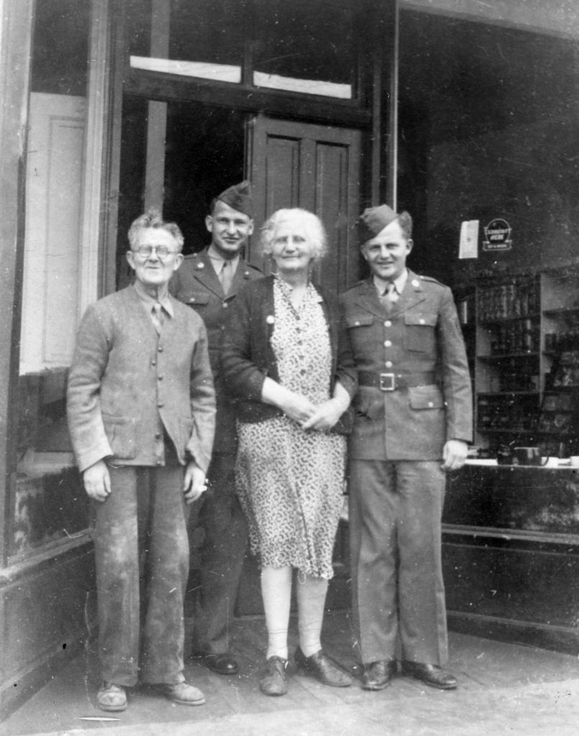 Robert Lyons with his parents and brother in front of Lyons General Store on Main Street in Cambria, 1943.