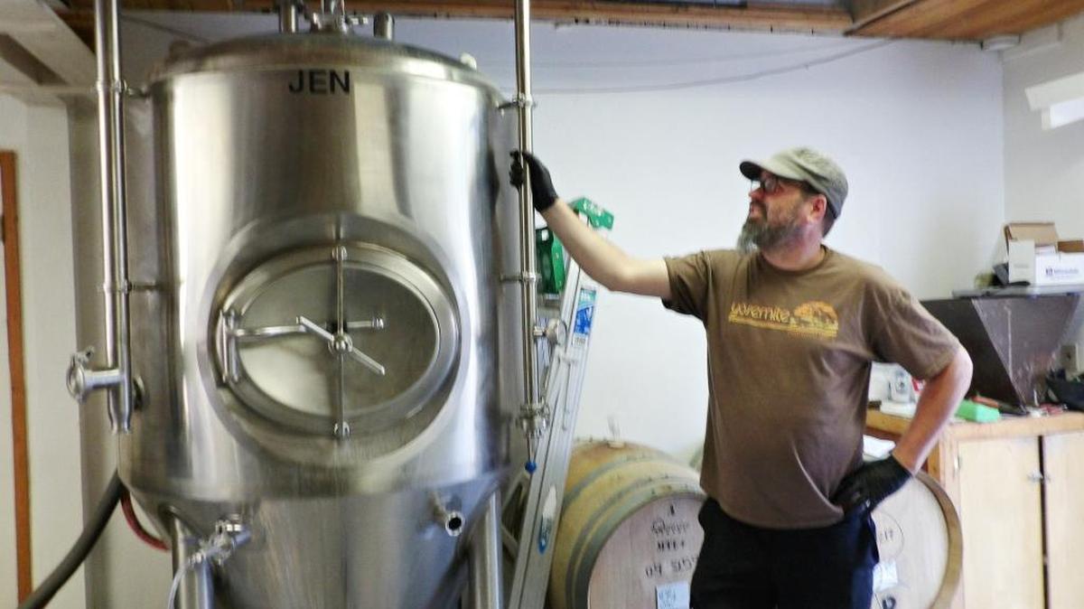 Aaron Wharton, proprietor of Cambria’s 927 Beer Co., brews a fresh batch of IPA in his stainless steel fermentation tank, which holds 217 gallons of beer.