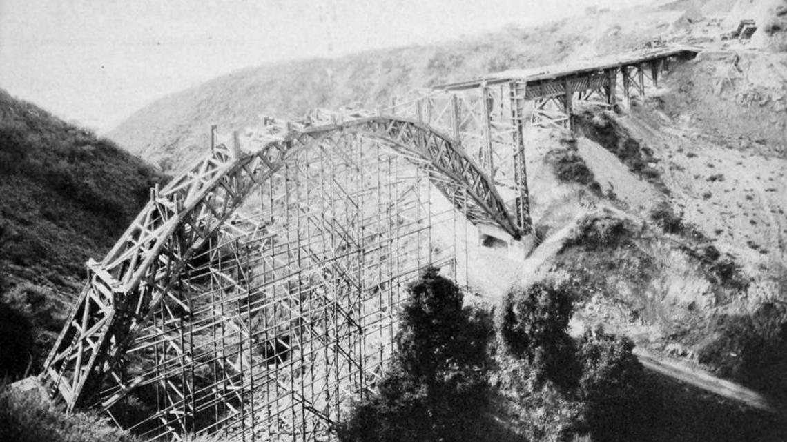 This photo shows the wooden Dolan Creek Bridge on Highway 1 south of Big Sur under construction around 1935. The bridge was150 feet above and 180 feet across the ravine floor and was one of 30 bridges built as part of the project to complete the highway from San Simeon to Carmel.