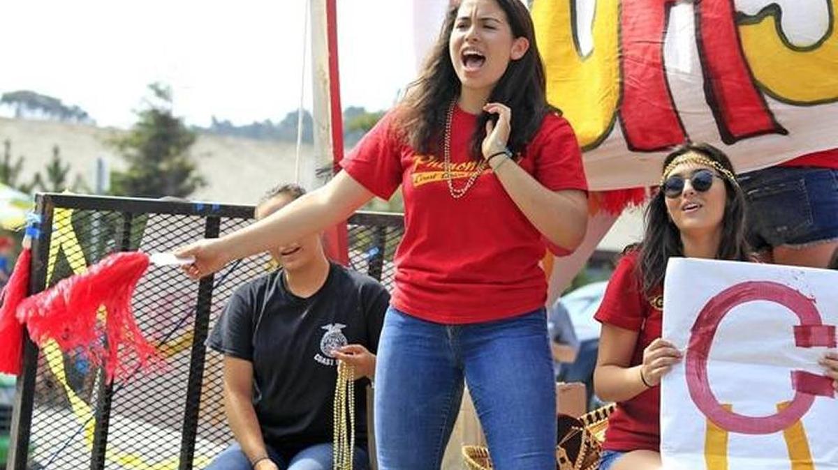 Coast Union High School’s float held a cheering section, from left (partially obscured) Kiana Valenzuela, 17, Hayley Zinn, 16, and Raely Barbosa, 17, right, during this year’s Pinedorado Parade in Cambria.