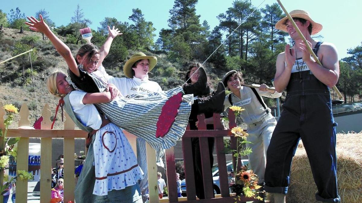 Linn’s float in the 2016 Pinedorado Parade featured, from left, Reese Tartalia, 11, Faith De La Cruz, 11 and Logan Hodges, 19, dressed as different characters from books.