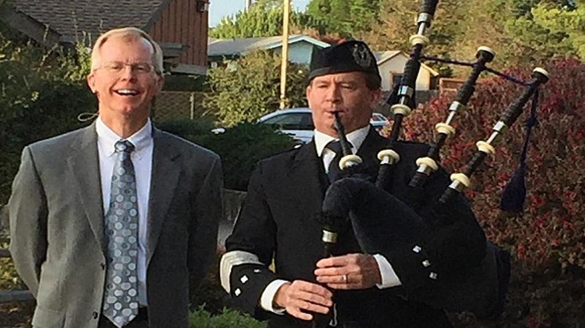Brant Baker is joined by an unidentified bagpiper at his installation as permanent pastor of Cambria Community Presbyterian Church.