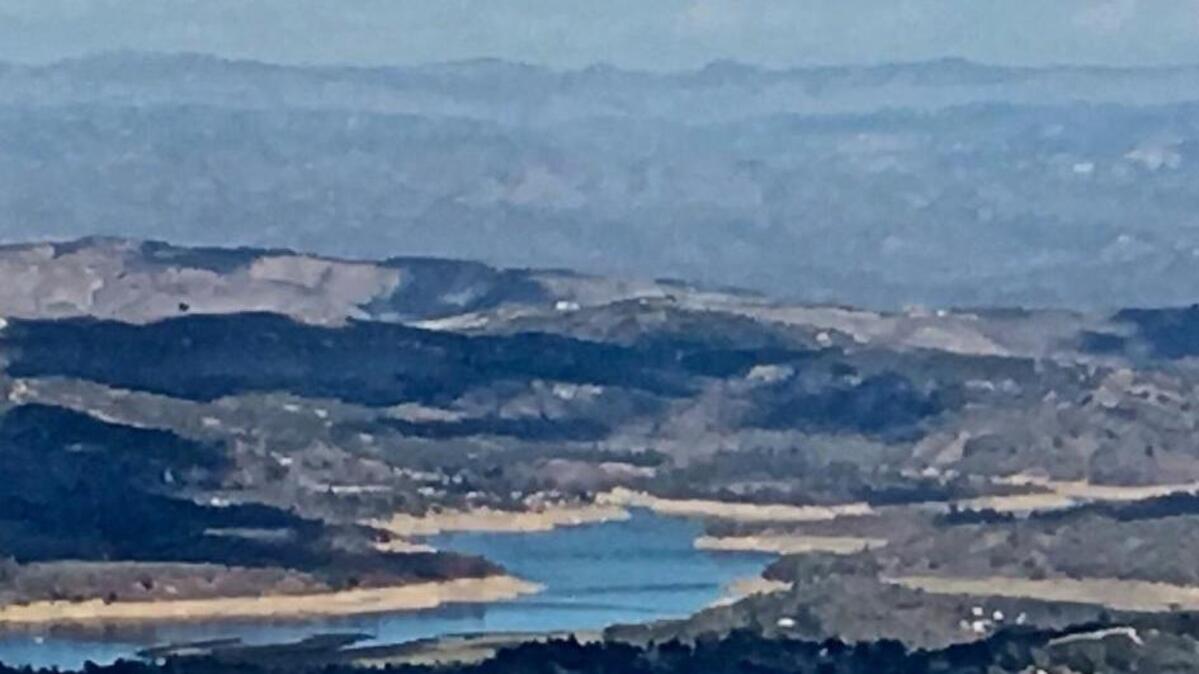 Lake Nacimiento, seen from the back side of Rocky Butte, is at just 44 percent of capacity, with the dry shoreline showing the depressed water level.