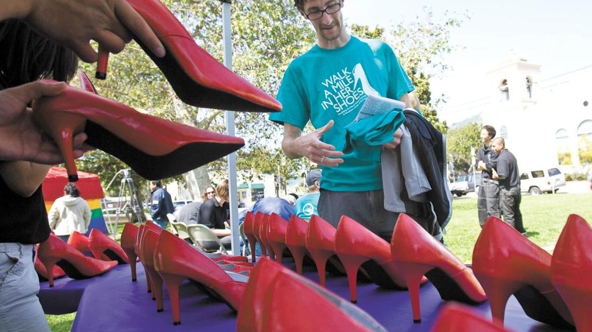 Matt Bush looks for a size 13 during the 2010 Walk a Mile in Her Shoes event in San Luis Obispo.