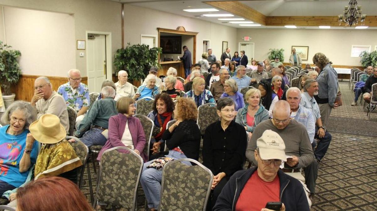Attendees wait for the start of a community forum for Cambria Community Services District candidates sponsored by Free and Equal Elections.