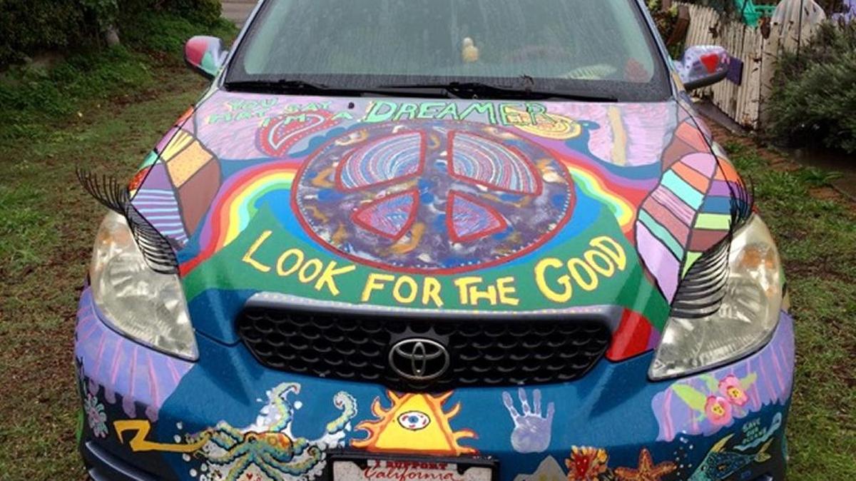The columnist’s “Happy Hippie Car,” complete with eyelashes, breathed its last on the way to San Jose.