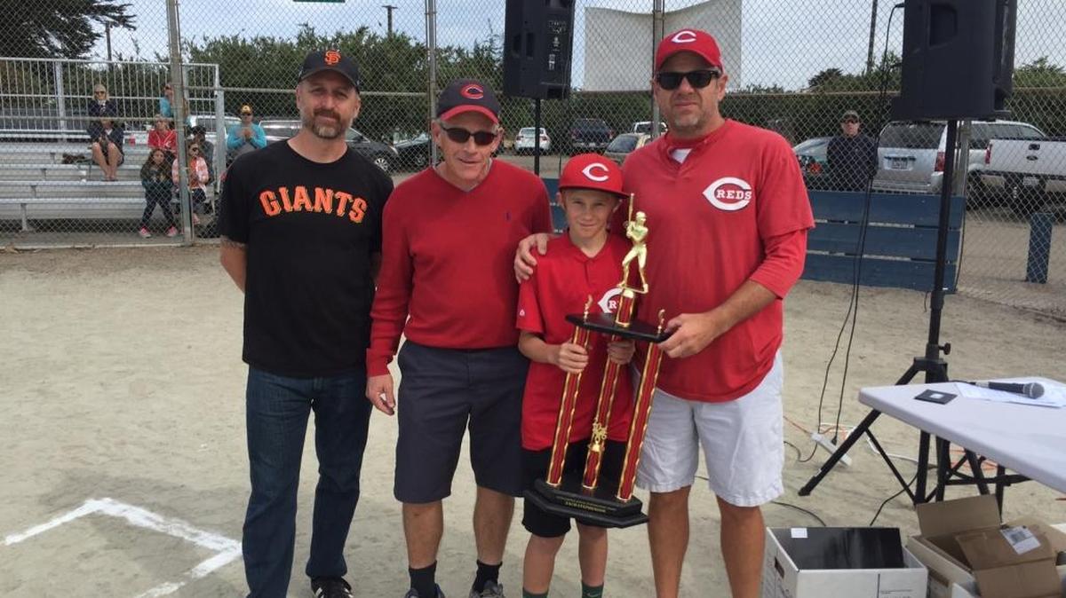The Kniffen Award ceremony on Saturday, June 4, at Lila Kaiser Park in Morro Bay: from left, Cambria Giants coach Matt Saunders, Steve Kniffen, Zack Stephenson and his father and Reds coach, Gary Stephenson.