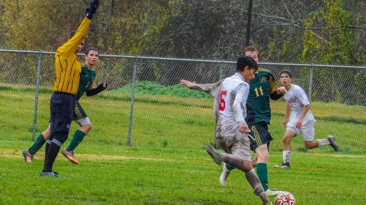Sophomore midfielder Dante Garcia (5) scored one of Coast Union’s two goals against Laguna Blanca on Jan. 14. Here he battles for the ball against Liberty on Jan. 9.
