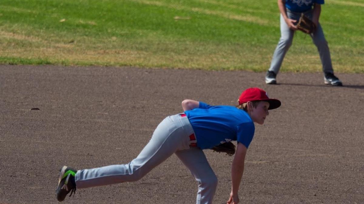 Cambria Reds pitcher Ryan Kasper pitches against the Los Osos Arnie’s Team on Sunday, Oct. 9. The Reds lost 14-0. Playing first base is Henry Wright.