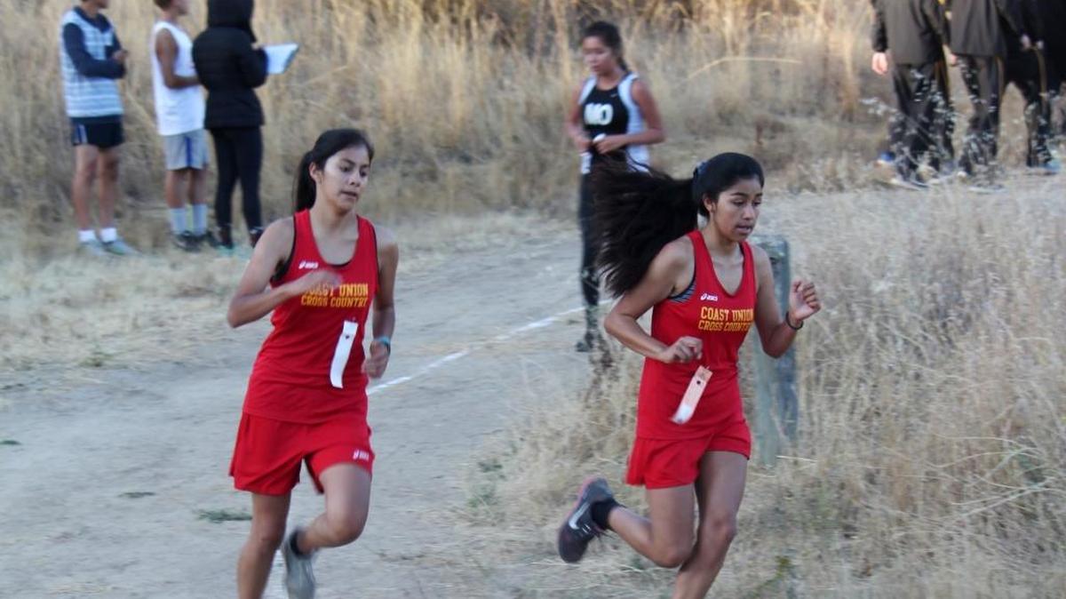 Coast Union runners Fabby Gonzalez, left, and Karina Mendoza finished 35th and 36th, respectively, Saturday, Oct. 1, at the BRUG Invitational 5K at Santa Margarita Lake.