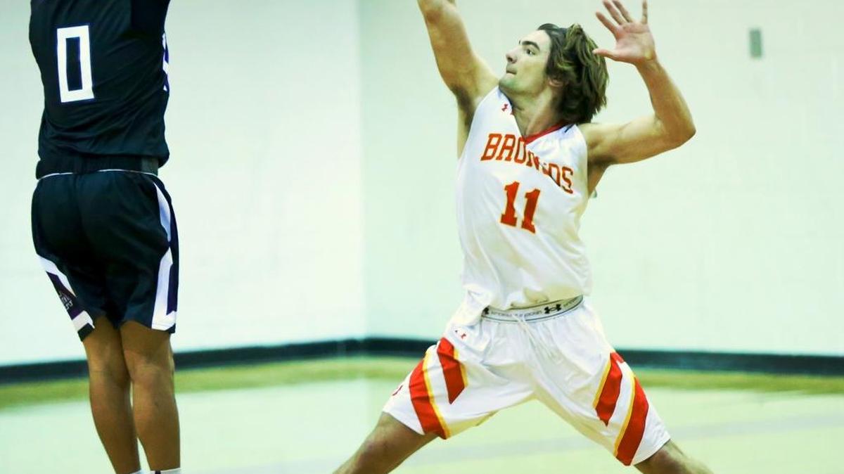 Senior Jez Lawson, who scored a team-leading 16 points against Mission Oak on Dec. 3, defends against a shot in the second half of the Broncos’ 45-41 win.
