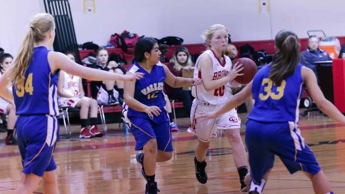 Senior Reagan Kniffen drives against Valley Christian Academy on Jan. 8 at Coast Union. the Lady Broncos lost 35-28.