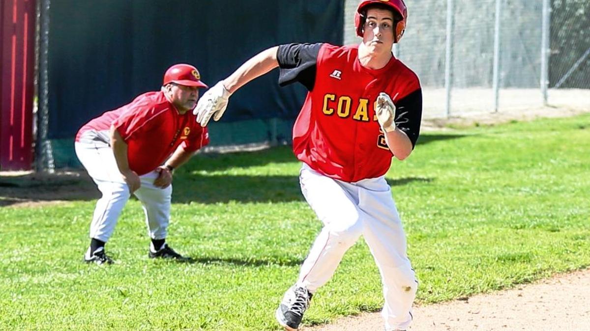 Baseball coach Brian Machado keeps an eye on other Bronco baserunners from his third base position, while Auggie Johnson prepares to slide home.