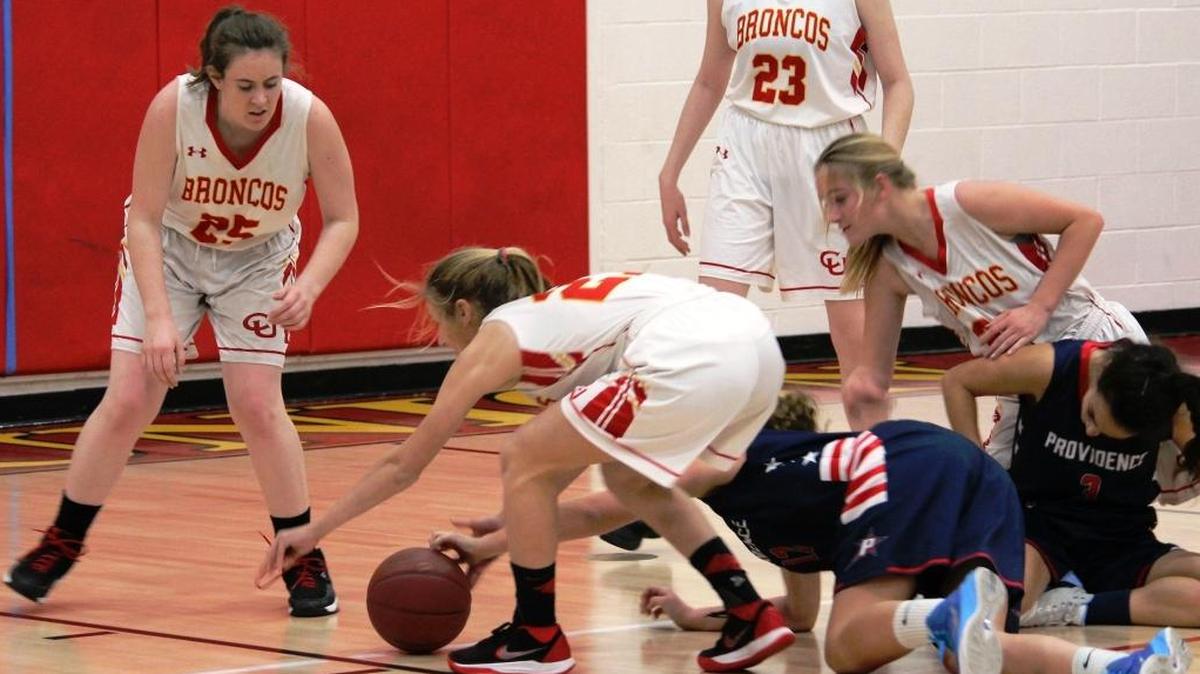 Junior guard Karis Lawson scored 13 against Coastal Christian on Jan. 23, and she had a double-double (16 points and 16 rebounds) Friday, Jan. 26 against Shandon. Here, she battles for ball control against Providence earlier this year. Meg Stern, left, Kaylee Ferguson (23) and Ellie Kennedy are in the picture.