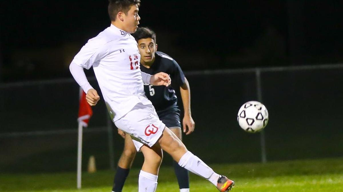 Freshman Emany Plasencia battles for the ball against Fresno Christian on Friday, Jan. 6. He scored a goal on Friday night and in the Garces Tournament in Bakersfield the following day.