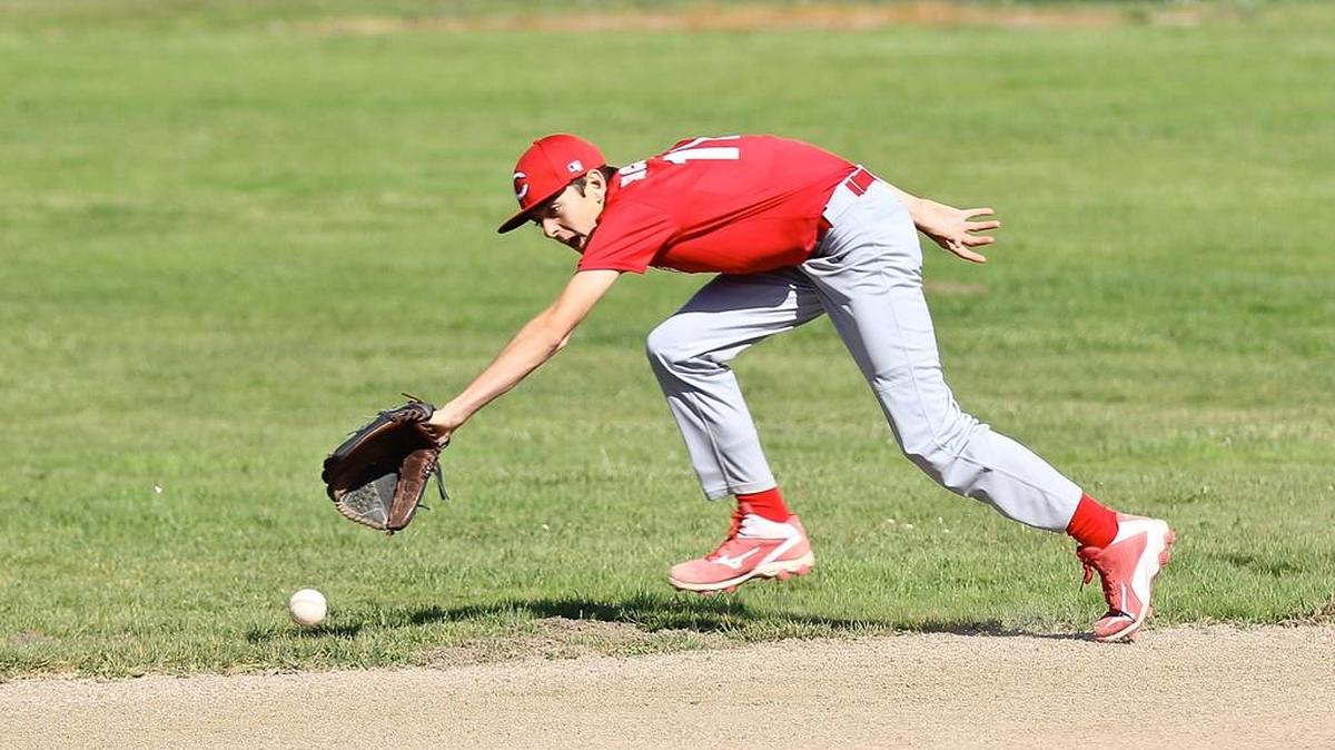 Fall Ball is a chance for kids to practice fielding. Here Nate Markham tries for a grounder on the Reds team this past spring.