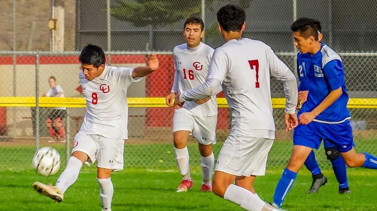 Senior midfielder Daniel Pena (8) was named Co-MVP for the 2017-18 soccer team (Ivan Favila shared the award with Pena). Also pictured are Damian Fernandez (16) and Salvador Aguilar (7).