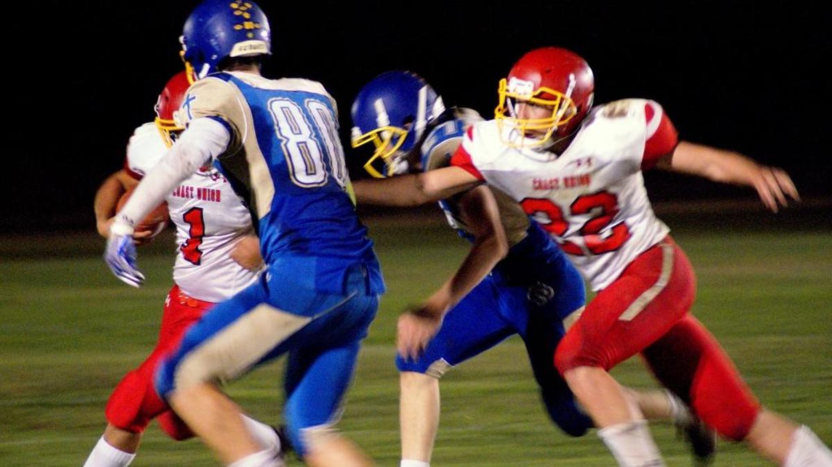 Senior Eddie Camacho (22) was the leading tackler on the Broncos in 2017; here he serves as a blocker in Coast Union’s game against Valley Christian Academy on Oct. 20.