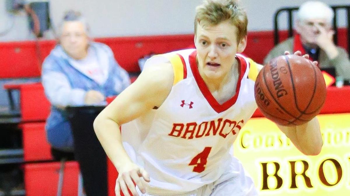 Senior Nick Roper comes off the bench for the Broncos and injects a whirlwind of energy with his passing and hustling. Here, he controls the ball against Laton earlier this season.